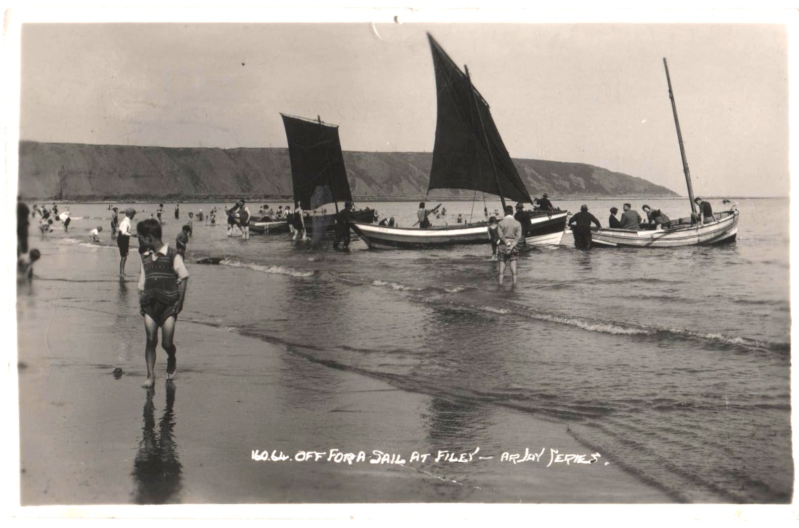 Holiday makers going afloat off Filey beach.